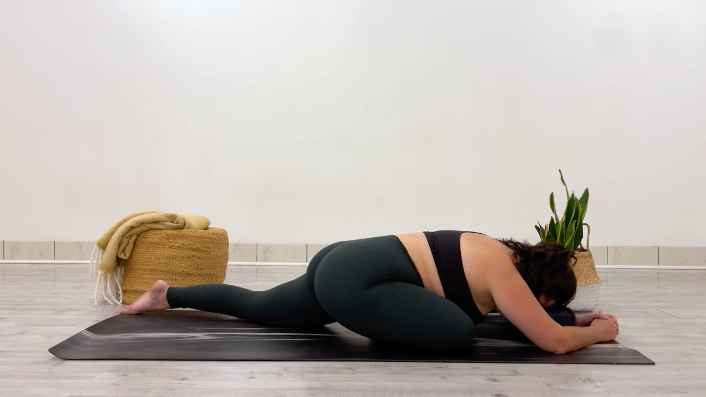 Yoga teacher Taylor Lorenz in Swan Pose, or Pigeon Pose, Eka Pada Rajakapotasana in Sanskrit